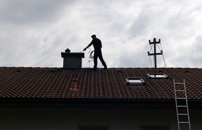 Inspection Technician Checking Chimney